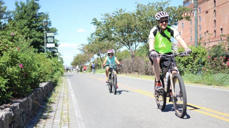 Two cyclists head south on the East Coast Greenway though Hudson River Park. The greenway is planned to span 3,000 miles from Maine to Florida.