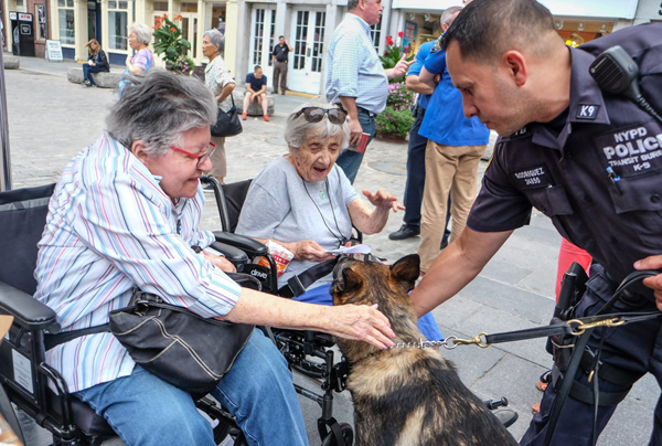 Photo by Tequila Minsky Locals got to meet cops of all shapes, sizes, and species at the First Precinct's National Night Out event on Aug. 2 at the South Street Seaport.