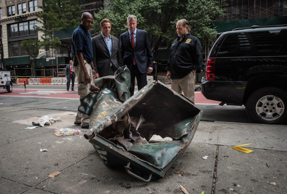 Governor Andrew Cuomo and Mayor Bill de Blasio inspect the rolling dumpster that was the point of origin for an explosion that shattered nerves in West Chelsea, at approximately 8:30 p.m. on Saturday eveing. | MICHAEL APPLETON/ OFFICE OF THE MAYOR