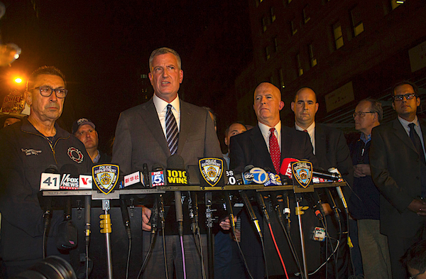 Mayor Bill de Blasio spoke at a press conference late Saturday night on West 23rd Street between Fifth and Sixth Avenues, was joined by new Police Commissioner James O’Neill, to the right of him, and Fire Department Commissioner Dan Nigro, to the left. | ZACH WILLIAMS