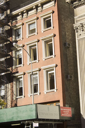 State Steps In to Ensure Insurance 2 The explosion blew out the front windows of the Townhouse Inn (above the King David Gallery), but the hotel has repaired them and re-opened on Oct. 1. Photo by Naeisha Rose.
