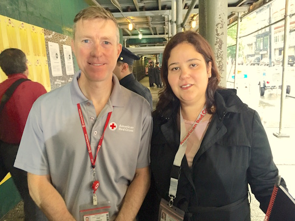 On W. 23rd St. underneath construction shedding that leads to Selis Manor: Josh Lockwood, Regional CEO of the Red Cross in Greater New York and Desiree Ramos Reiner, External Affairs Officer of the Red Cross in Greater New York. Photo by Eileen Stukane.