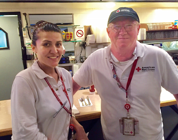 L to R: Lorena Velastegui and Paul Allwright are among the 50 Red Cross volunteers serving the needs of the community following the W. 23rd St. explosion. Photo by Eileen Stukane.