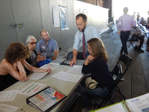 PB Preps for Year Three of Cool Mil Cap Funds Dispersal 4 Johnson’s Chief of Staff, Matt Green, with a model of a raised pedestrian crosswalk, one of the winning projects from District 3’s first year of Participatory Budgeting. Photo by Sean Egan.