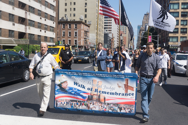 To Honor His Legacy, Build Upon It 1 The Walk of Remembrance makes its way down Seventh Ave. Photo by Daniel Kwak.