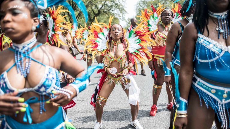 Costumed dancers march the West Indian Day Parade along Eastern Parkway in Brooklyn on Monday, Sept. 5, 2016.