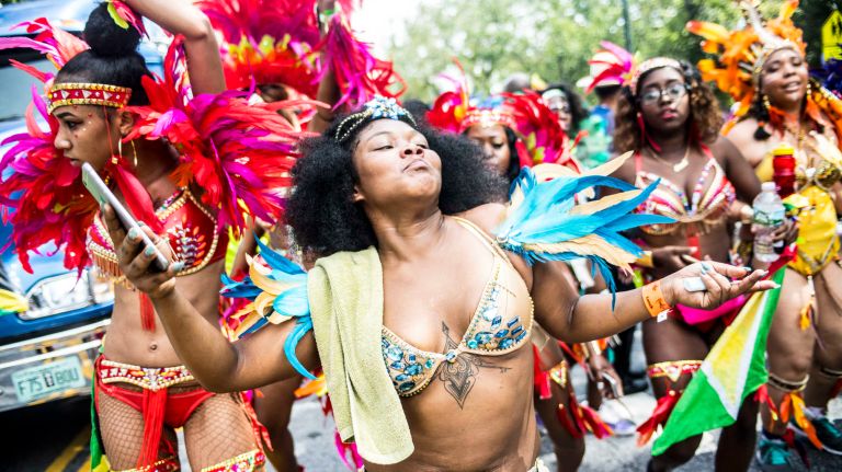 Costumed dancers march in the West Indian Day Parade along Eastern Parkway in Brooklyn on Monday, Sept. 5, 2016.