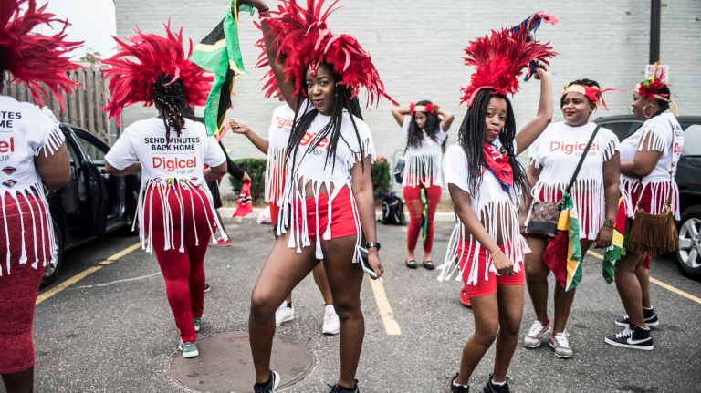 Costumed dancers get ready to march in the West Indian Day Parade along Eastern Parkway in Brooklyn on Monday, Sept. 5, 2016.