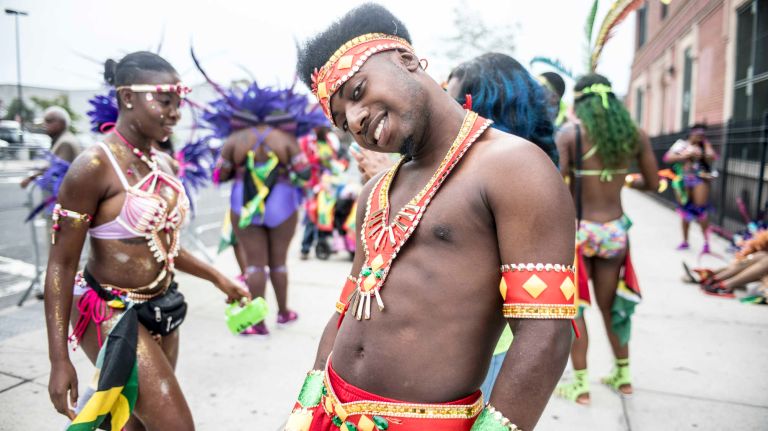 Costumed dancers get ready to march in the West Indian Day Parade along Eastern Parkway in Brooklyn on Monday, Sept. 5, 2016.