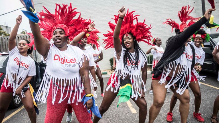 Costumed dancers get ready to march in the West Indian Day Parade along Eastern Parkway in Brooklyn on Monday, Sept. 5, 2016.