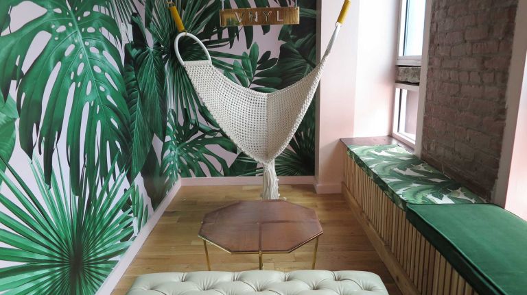 Walk a flight up to the mezzanine, which overlooks the main bar area, where guests have the option to receive tableside mixology. Even further up is the super-niche Champagne Garden (which features an extensive list of Champagnes and sparkling wines -- not to mention a swing), as well as the Black Rose Room, which plays home to another full bar.