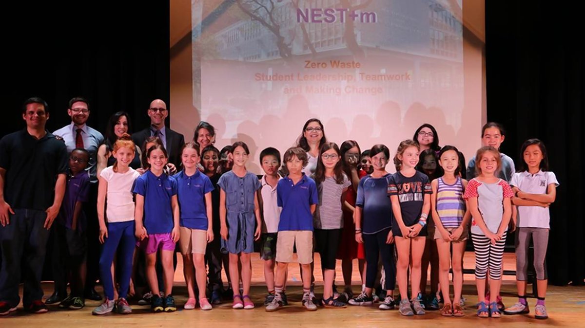 NEST + m students at a ceremony near the end of school last year, when they were recognized for their amazing waste-reduction efforts.
