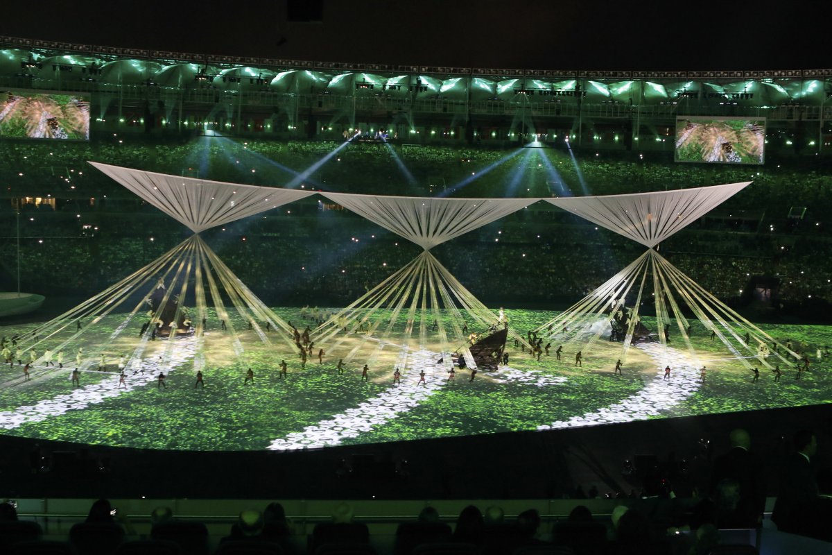 A segment of the Rio Olympics opening ceremony, showing indigenous peoples in lushly forested Brazil as the Spanish “discoverers” arrive on their ships. Photo by Fernando Frazão/Agência Brasil 