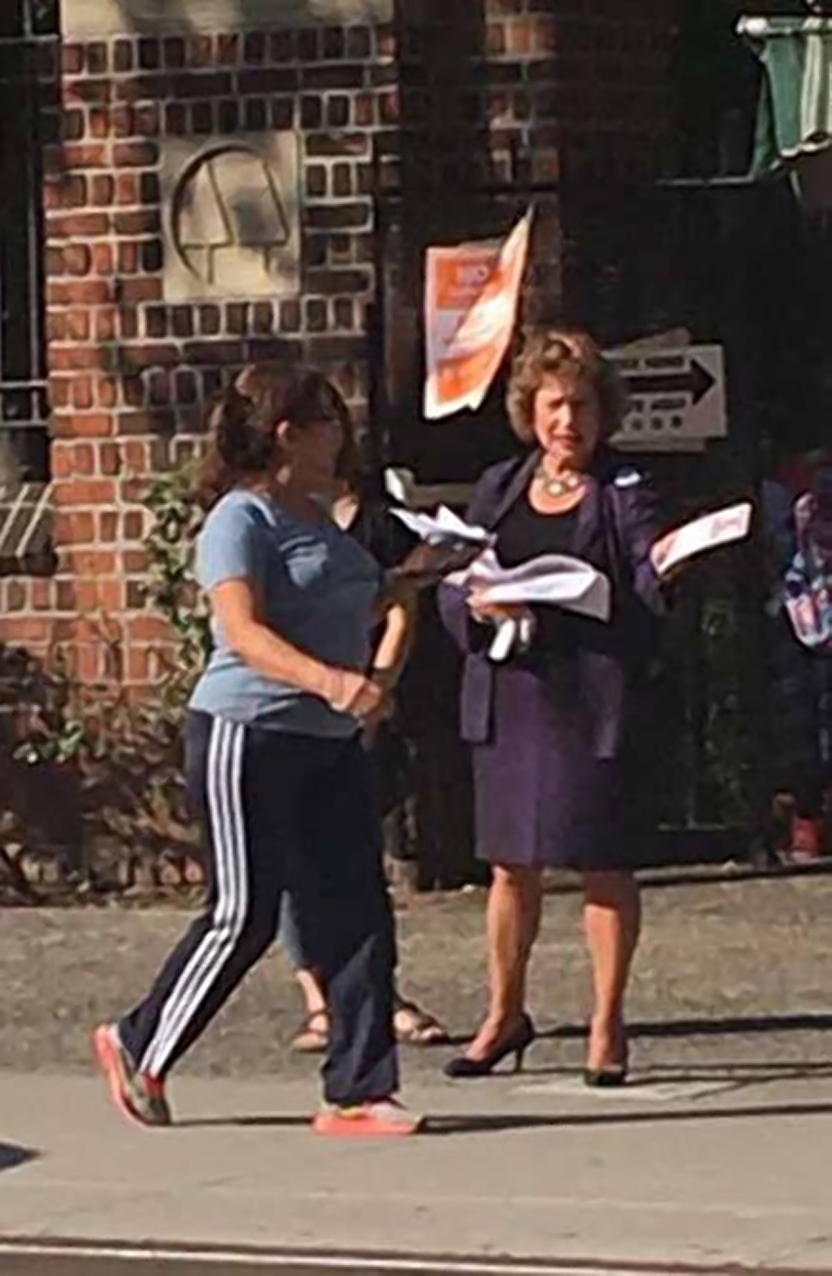 Judy Rapfogel handing out fliers for Alice Cancel for Assembly on Grand St. on Tuesday. Photo by Grand View