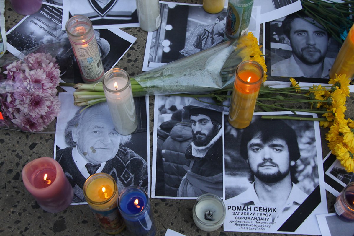 A few of the photos of the Maidan Revolution’s dozens of victims that were left at a sidewalk memorial on Second Ave. in the East Village in February 2014. The neighborhood boasts a sizeable Ukrainian population. File photo by Tequila Minsky
