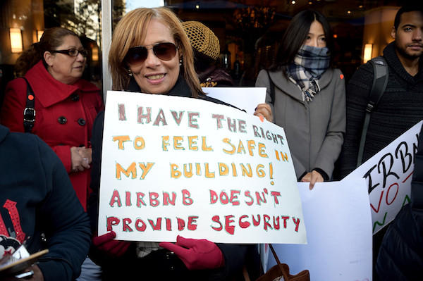 A demonstrator arguing that home-sharing reduces safety in multi-family buildings. | DONNA ACETO 