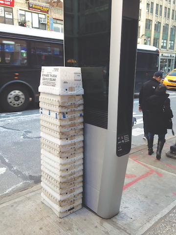 John A. Mudd of the Midtown South Community Council said the corner of West 40th Street and Eighth Avenue was “the hottest spot” for abuse of LinkNYC kiosks, with Postal Service crates used as chairs by people monopolizing the web browsers that are now disabled. | JOHN A. MUDD 