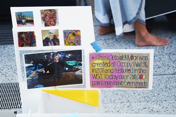 David Everitt-Carlson's display, set up along the High Line, notes the project's roots in the Occupy Wall Street Movement. Photo by Nicole Javorsky.