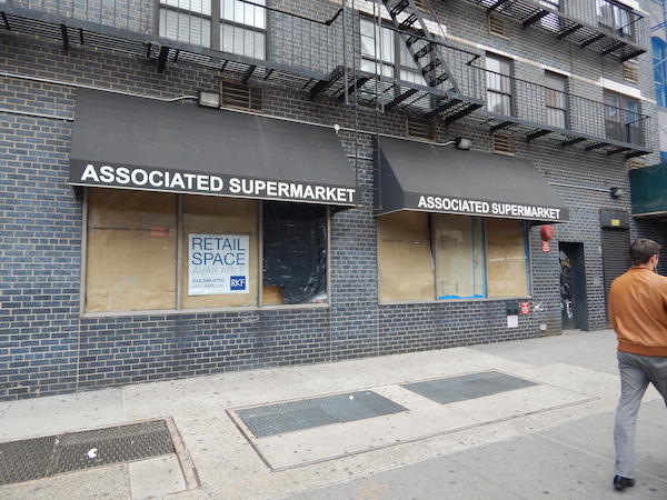 The recently closed Associated Supermarket — another victim of rising rents, which helps create grocery-starved “food deserts.” Photo by Sean Egan.