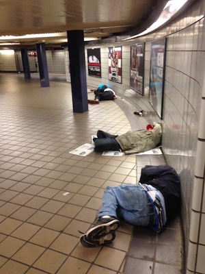 John A. Mudd, who has lived at W. 38th St. since 1984, says the homelessness problem in the area has persisted on and off for decades. In photo, people sleep at the subway entrance at W. 40th St. & Eighth Ave. Photo by John A. Mudd.