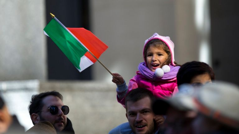 What if Columbus met Native Lives Matter? 2 A girl waves an Italian flag during the Columbus Day Parade in Manhattan on Monday.