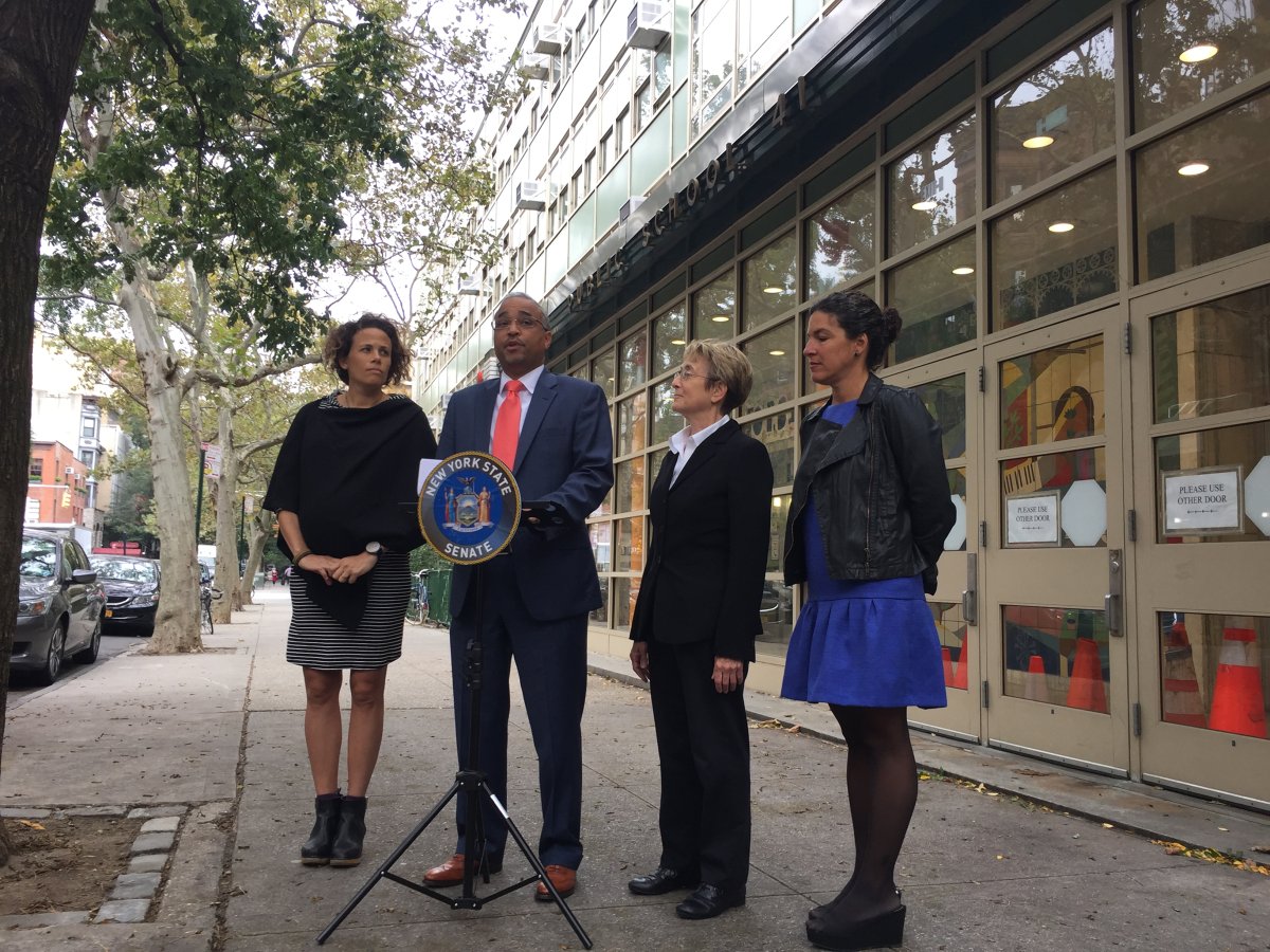 At a press conference outside P.S. 41 in the Village regarding a bill to curb speeding near schools, from left, Caroline Samponaro, of Transportation Alternatives; State Senator Jose Peralta; Assemblymember Deborah Glick; and Cristina Furlong, co-founder of Make Queens Safe. Photo by Dennis Lynch