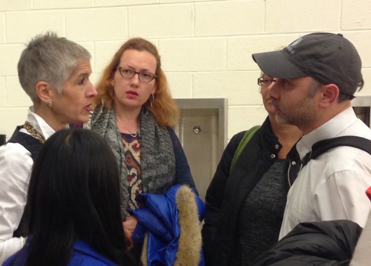 Jacqui Getz, the principal of the new 75 Morton middle school, left, spoke to a group of parents after a “Meet the Principal” event on Nov. 15. Photo by Sara Hendrickson