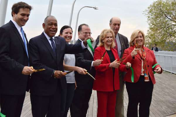 The Parks and Recreation Department's Manhattan Borough Commissioner William Castro, Deputy Borough President Matthew Washington, City Councilmember Ben Kallos, Parks Commissioner Mitchell Silver, Friends of the East River Esplanade chair Jennifer Ratner, Community Board 8 chair Jim Clynes, Congressmember Carolyn Maloney, Waterfront Alliance president and CEO Roland Lewis, and Assemblymember Rebecca Seawright at the ribbon-cutting. | JACKSON CHEN