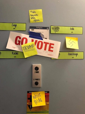 Threatened: Post-its with hate messages on the door of four students’ shared suite at NYU’s Gramercy Green residence, at E. 23rd St. & Third Ave. Photo courtesy The Villager.