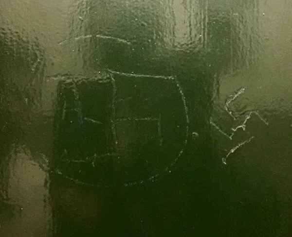 A neighbor discovered these two swastikas etched into a service-elevator door at State Sen. Brad Holyman’s Fifth Ave. apartment building. Photo courtesy Office of State Sen. Brad Hoylman.
