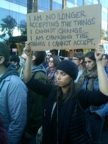 Thousands More Turn Out Sunday in Columbus Circle 5 One demonstrator changed up a familiar recovery slogan. | MANHATTAN EXPRESS