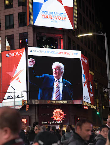 Pro-Clinton Manhattan Stunned, Dismayed by Trump Upset 1 The president-elect appears on a Times Square jumbotron in the early morning hours of November 9. | DANIEL KWAK