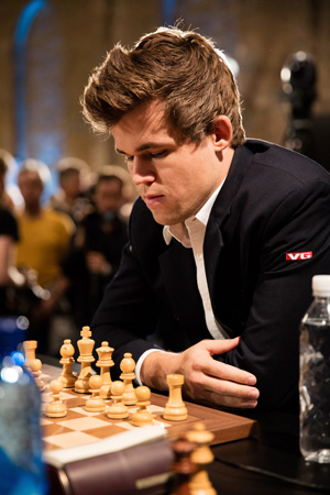 Photo by Sebastian Reuter World chess champion Magnus Carlsen, 25, will face off against 26-year-old challenger Sergey Karjakin in a 12-game match played over the course of 20 days at the South Street Seaports Fulton Market Building to determine the new world champion.