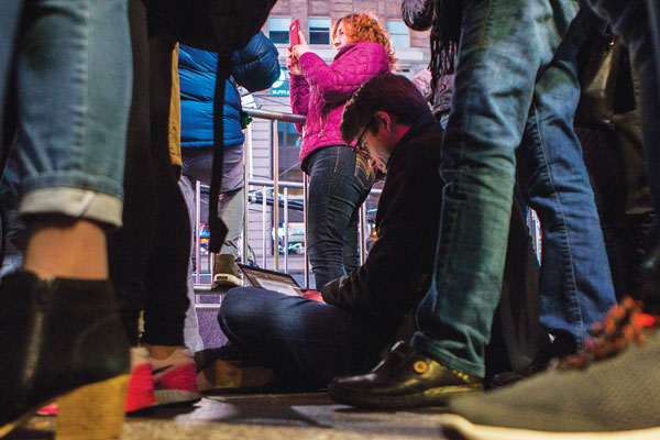 In Hell’s Kitchen, An Election Night Endurance Test 4 A French journalist works on an article as he waits for election results in Times Square on Tuesday night. Photo by Zach Williams.