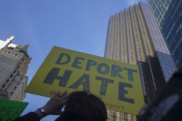 A United Front Against Trump Forming Among Activists 5 From the Nov. 12 march, outside Trump Tower on Fifth Ave., a protester’s sign turns the tables on a controversial campaign promise. Photo by Zach Williams.