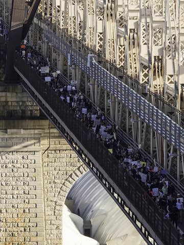 The marchers cross the Queensboro Bridge on their way to Trump Tower. | NICK STAIB 