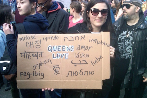 Alexis Kaloyanides from Jackson Heights celebrates all the languages spoken in Queens during the march on Trump Tower. | ANDY HUMM 