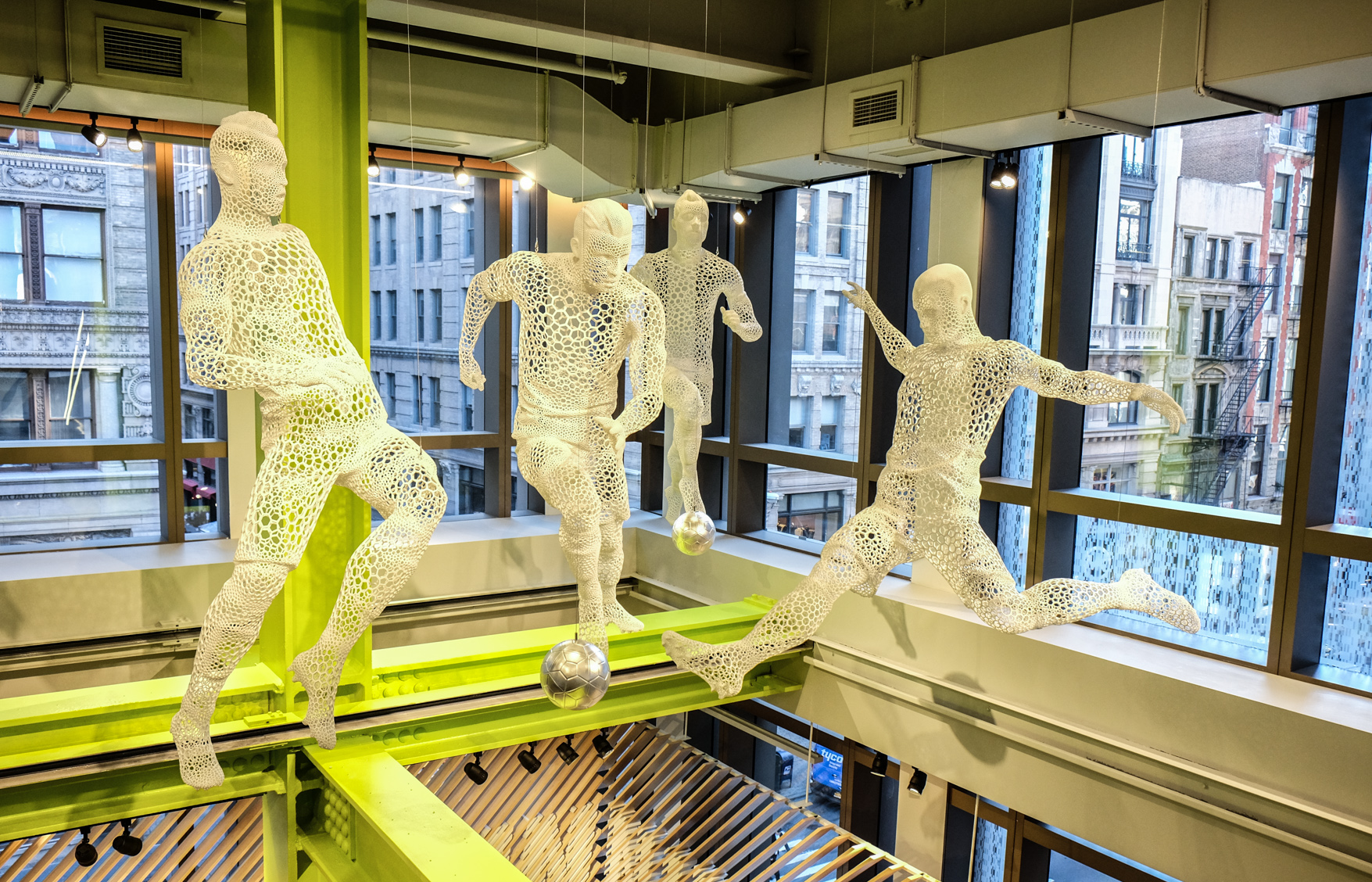 Niketown beats community’s full-court press 4 There's even space for these whimsical sculptures, like these soccer players — the building is that big.