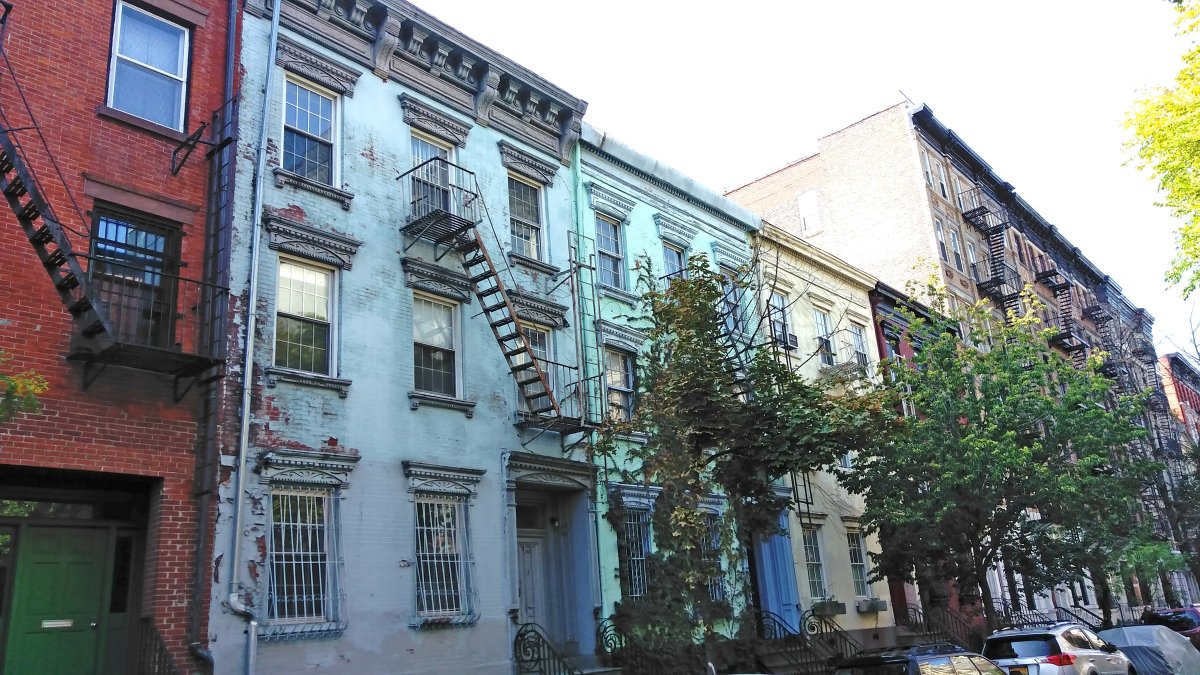 L.P.C. ‘No’ on ‘Political Row’ causes a row in East Village 1 The owner of 264 E. Seventh St., the blue building second from left, next to the red-brick building, has filed a permit to demolish the entire structure. Photo by Dennis Lynch