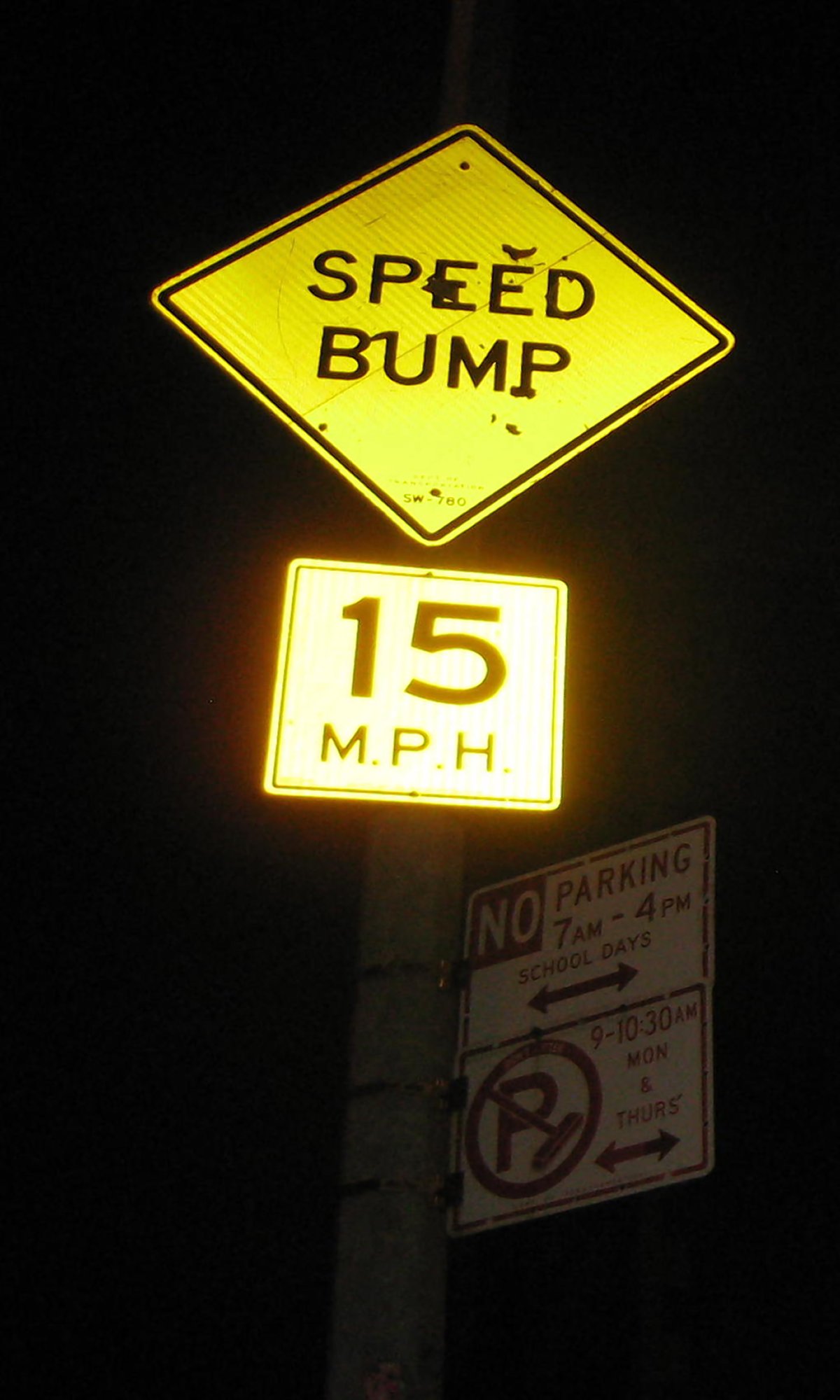 East Village slow zone quickly increases safety 2 New signage for the East Village Slow Zone alerts drivers of a speed limit of 15 miles per hour and a speed bump outside the Neighborhood School, at 121 E. Third St. Photo by Lesley Sussman