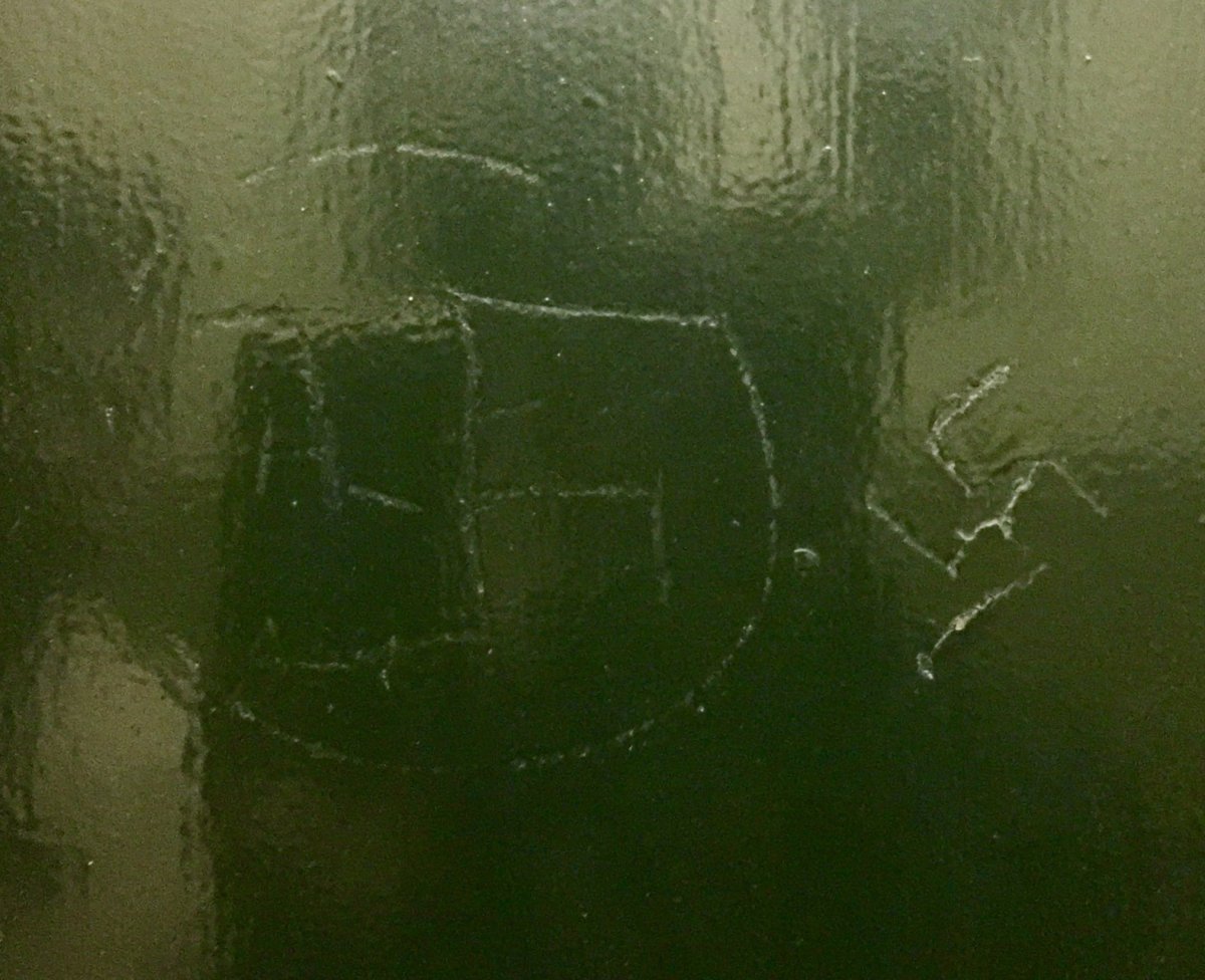 A neighbor discovered these two swastikas etched into a service-elevator door at state Senator Brad Holyman’s Fifth Ave. apartment building. One appears to be covered up with green paint, and police said it’s not clear how long they were there. Photo courtesy Brad Hoylman