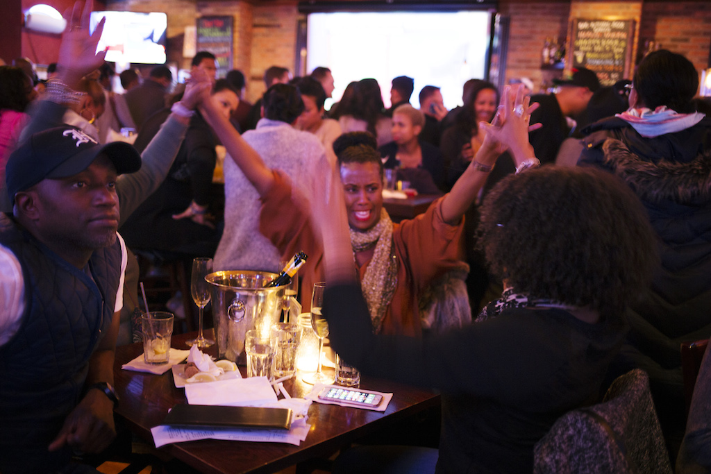 On election night, Hillary Clinton supporters gathered uptown at Harlem Tavern were ebullient as she scored an early win in Virginia. Photos by Q. Sakamaki