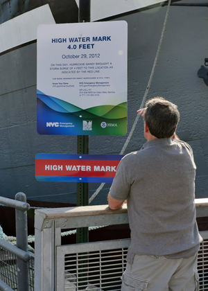 Photo by Milo Hess This high-water-mark sign, marking the height of Superstorm Sandy’s flood surge, will serve as a permanent reminder of how vulnerable the Seaport is to extreme storms.