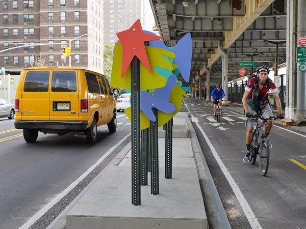 Street art: New median and ‘art intervention’ protecting cyclists along South St. 1 Photo by Milo Hess The city installed the six-foot-wide concrete median along three blocks of South St. — decorated with 124 colorful wooden cutouts — to protect cyclists and beautify the neighborhood.