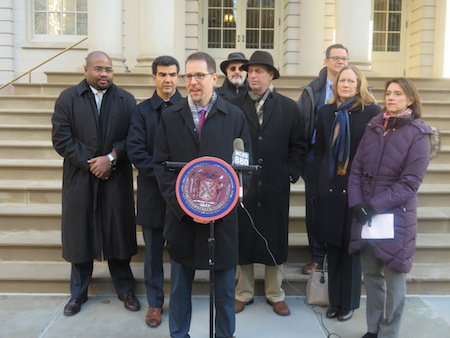 City Councilmembers Mark Levine (at podium) and Ydanis Rodriguez (to Levine’s left facing photo) at a January 6 City Hall press conference renewing their call for a  north-south West Side ferry service route. | COURTESY: OFFICE OF COUNCILMEMBER MARK LEVINE 