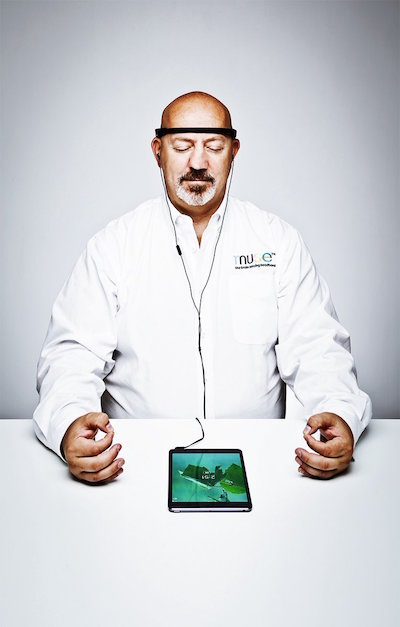 A man demonstrates how to meditate using the Muse headband and associated app. Image via choosemuse.com. 