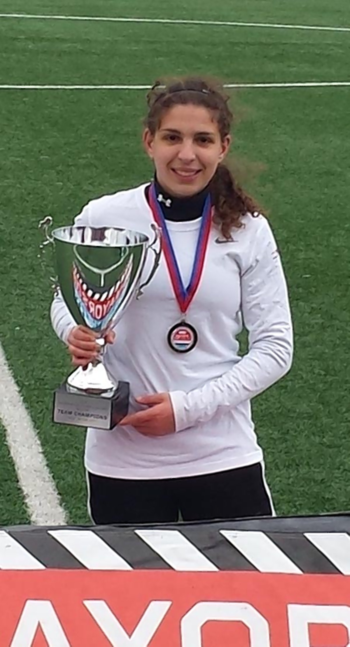 Daniela Zirpolo after the Mayor’s Cup Soccer Championship at St. John’s University, holding the trophy given to the winning team.