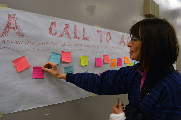 A post-it wall for suggestions in the lobby area outside of where CIty Councilmember Dan Garodnick held a community forum on defending New York values. | JACKSON CHEN 