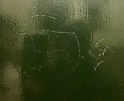 A neighbor discovered these two swastikas etched into a service-elevator door at State Senator Brad Holyman’s Fifth Avenue apartment building. | OFFICE OF STATE SENATOR BRAD HOYLMAN