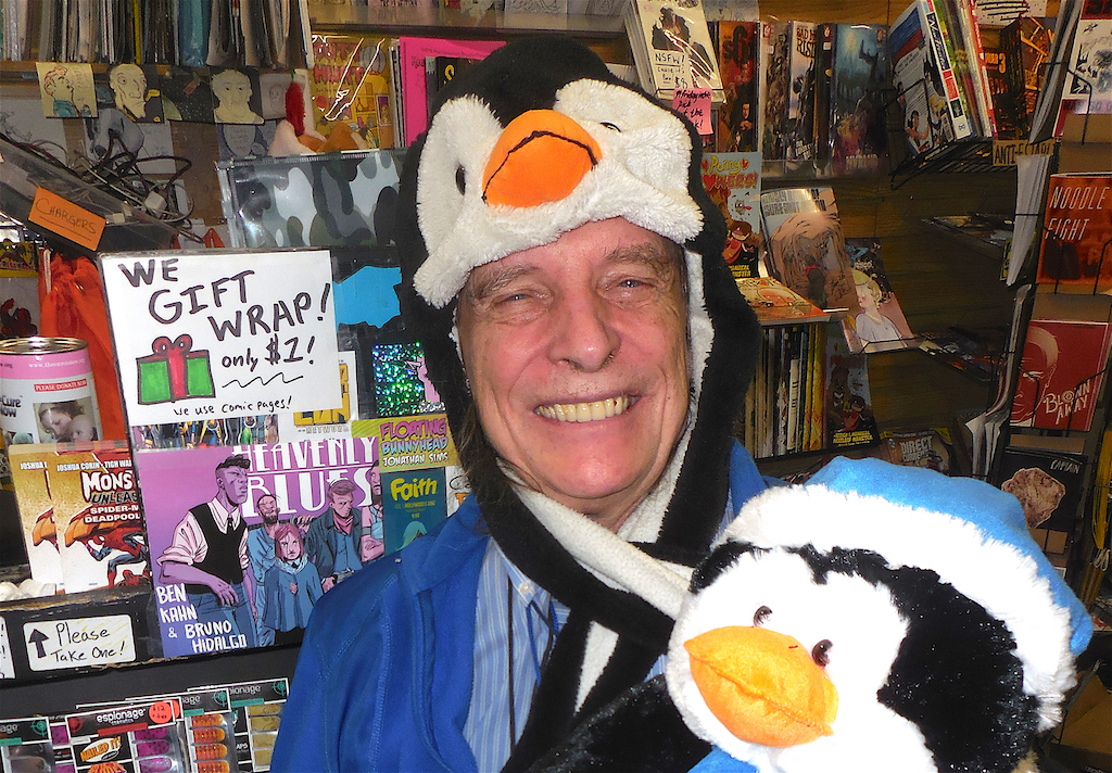 Just chillin’: Jean-Louis Bourgeois got a penguin from former Lenape chief Anthony Van Dunk for Christmas. It goes well with his penguin hat — with special extra-long ear flaps / neck warmers. Bourgeois bought the bonnets in bulk in Harlem — they may not all be penguins — and has been outfitting the Standing Rock protesters with them to help them brave the Dakota cold. He also is equipping them night goggles to catch sneaky law enforcement officers. Whatever it takes. Photo by Sharon Woolums